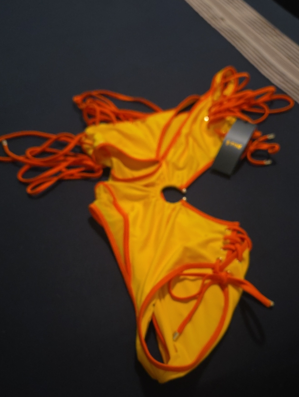 Bright Yellow One-Piece Swimsuit with Orange Trim and Ring Detail